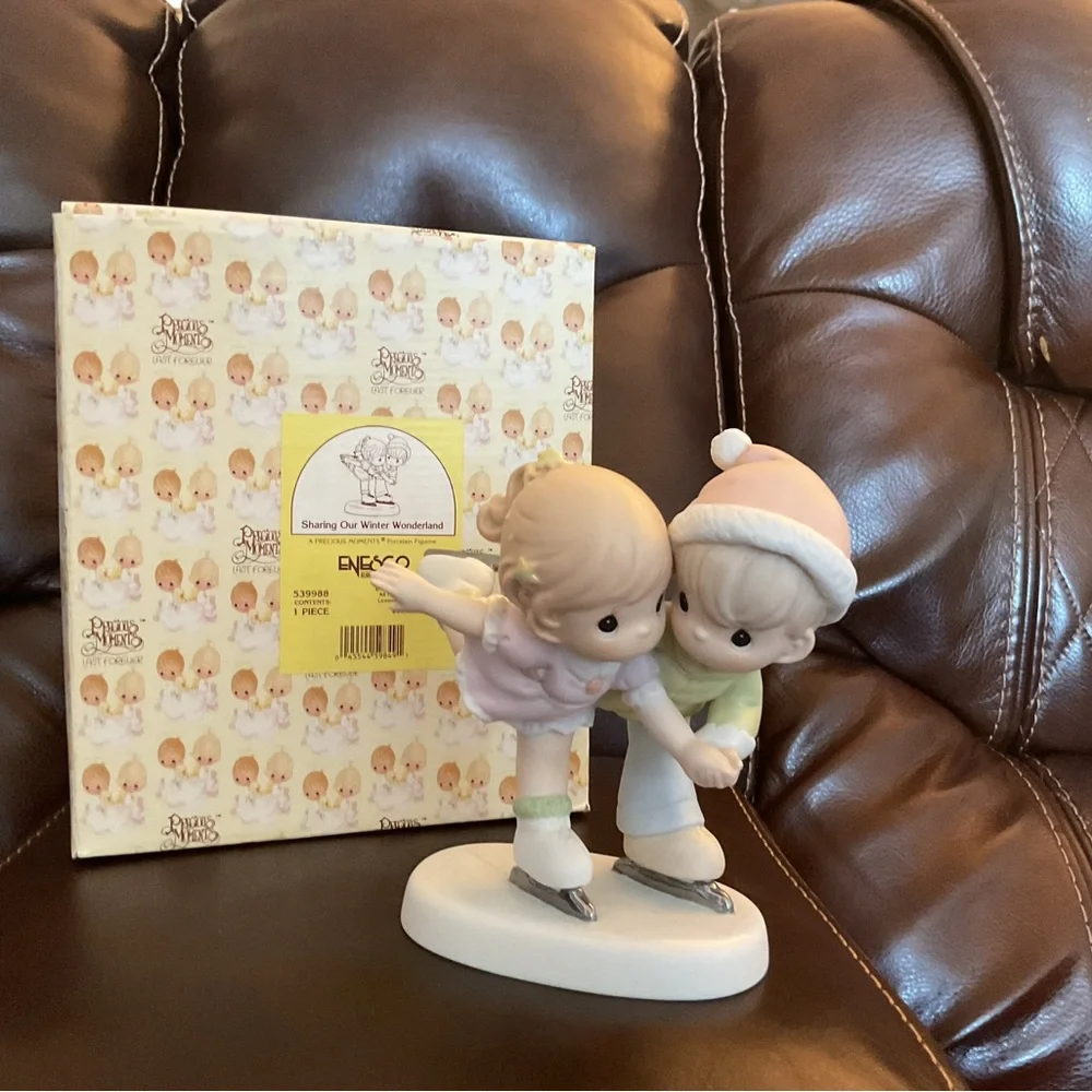 Precious Moments SHARING OUR WINTER WONDERLAND figurine. Like new.